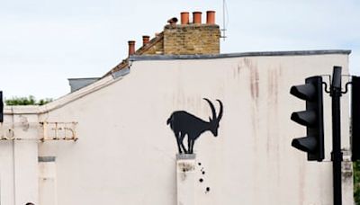 Banksy’s billboard cat removed as meaning of his London animals revealed