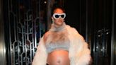 Rihanna proudly shows off baby bump in new Louis Vuitton campaign photo