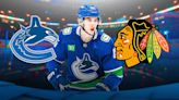 Canucks clear cap space with Blackhawks trade