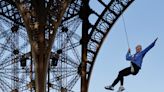 Woman rope climber scales Eiffel Tower with bare hands in record-breaking time