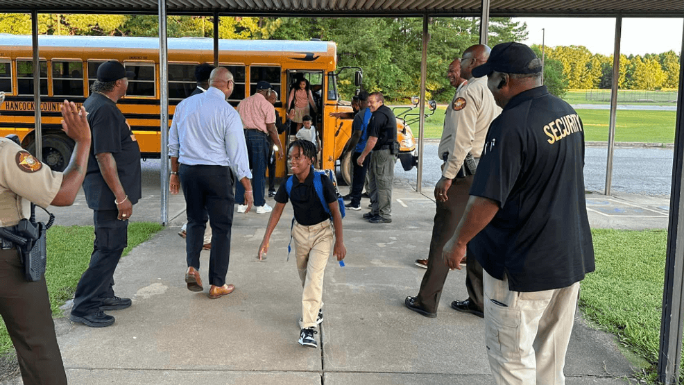 Hancock County men welcome new, returning students to Marvin E. Lewis Elementary