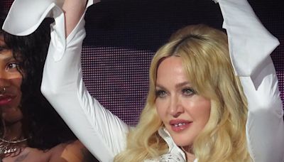 Madonna, 65, flashes her bra in saucy mini dress at drag festival