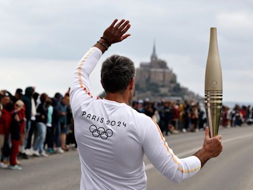 France’s Bastille Day parade meets the Olympic torch relay in an exceptional year