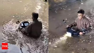 Vadodara youth rides submarine Ola electric scooter in flooded street: Risks explained - Times of India