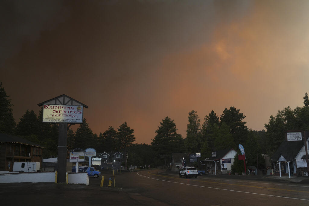 A scenic Southern California mountain town walloped by a blizzard is now threatened by wildfire