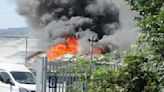 Warning to 'keep away' as large fire breaks out at industrial site | ITV News