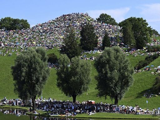 Taylor Swift fans swarm hill in Munich, claiming a high perch for watching concert for free