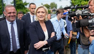 The Latest | Projections show far-right National Rally has strong lead in France's 1st voting round