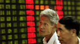 China cuts 1-year benchmark rate to boost economy as world markets lag