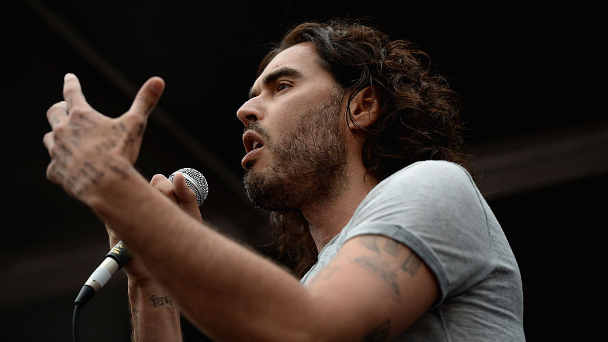 Russell Brand Shares Incredible Photo Captured During His Baptism In The River Thames With Friend Bear Grylls