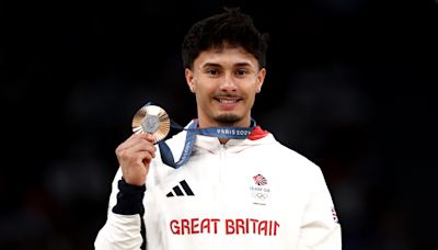 Jake Jarman wins bronze having started gymnastics after advice from a stranger