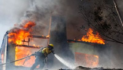 Neighbors fight flames as Edgehill fire consumes homes in San Bernardino; one person detained