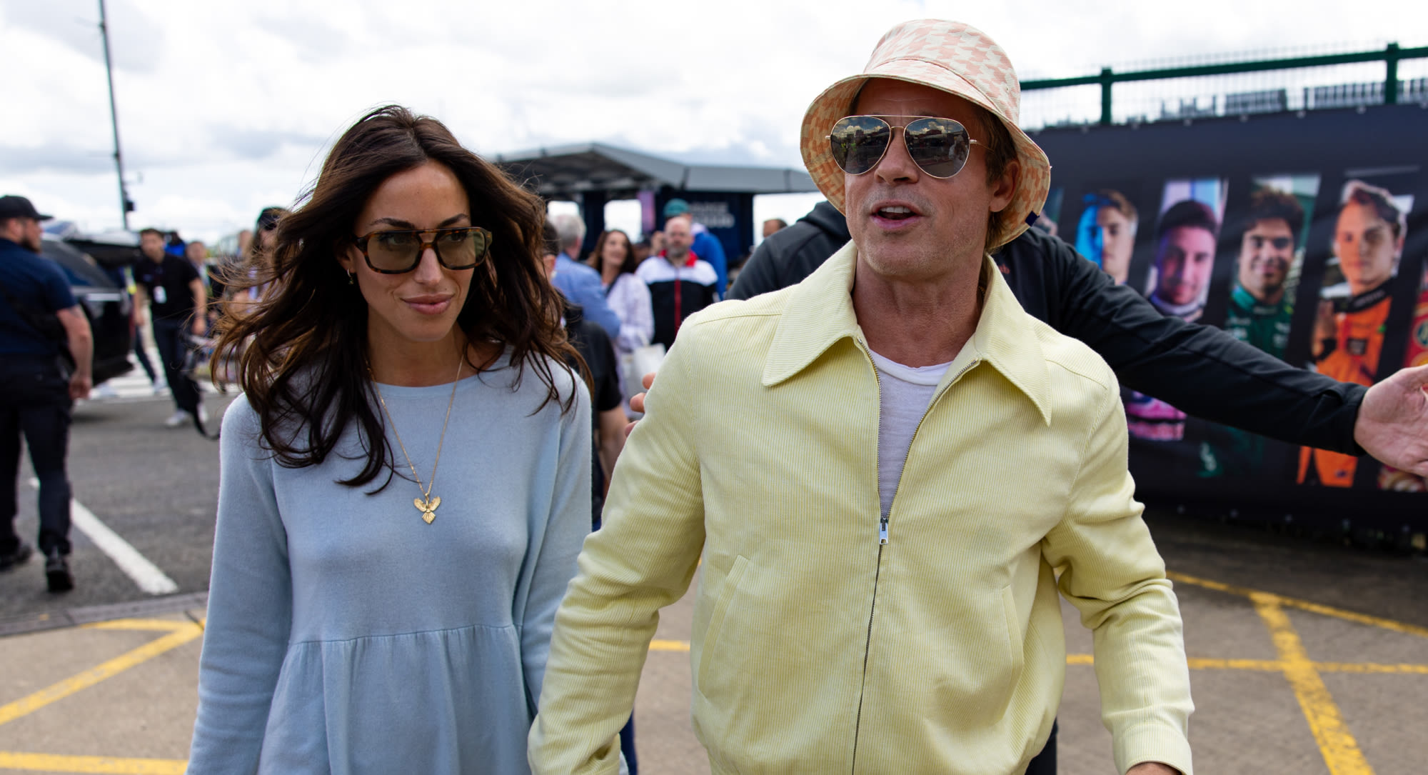 Brad Pitt and Girlfriend Ines de Ramon Coordinate in Pastel Colors for F1 British Grand Prix