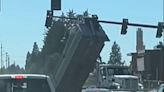 Dump truck takes out traffic signal in east Vancouver near Costco