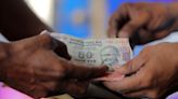Rupee pressed by equity outflows, supported by soft dollar