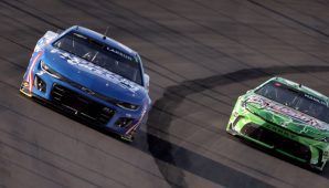 Kyle Larson wrecks into Denny Hamlin after contact with Daniel Suárez at Iowa