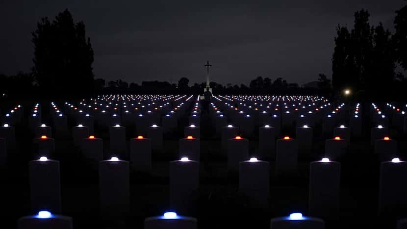 Photo slideshow: At Normandy, thousands of tombstones are lit by candle in memory of D-Day