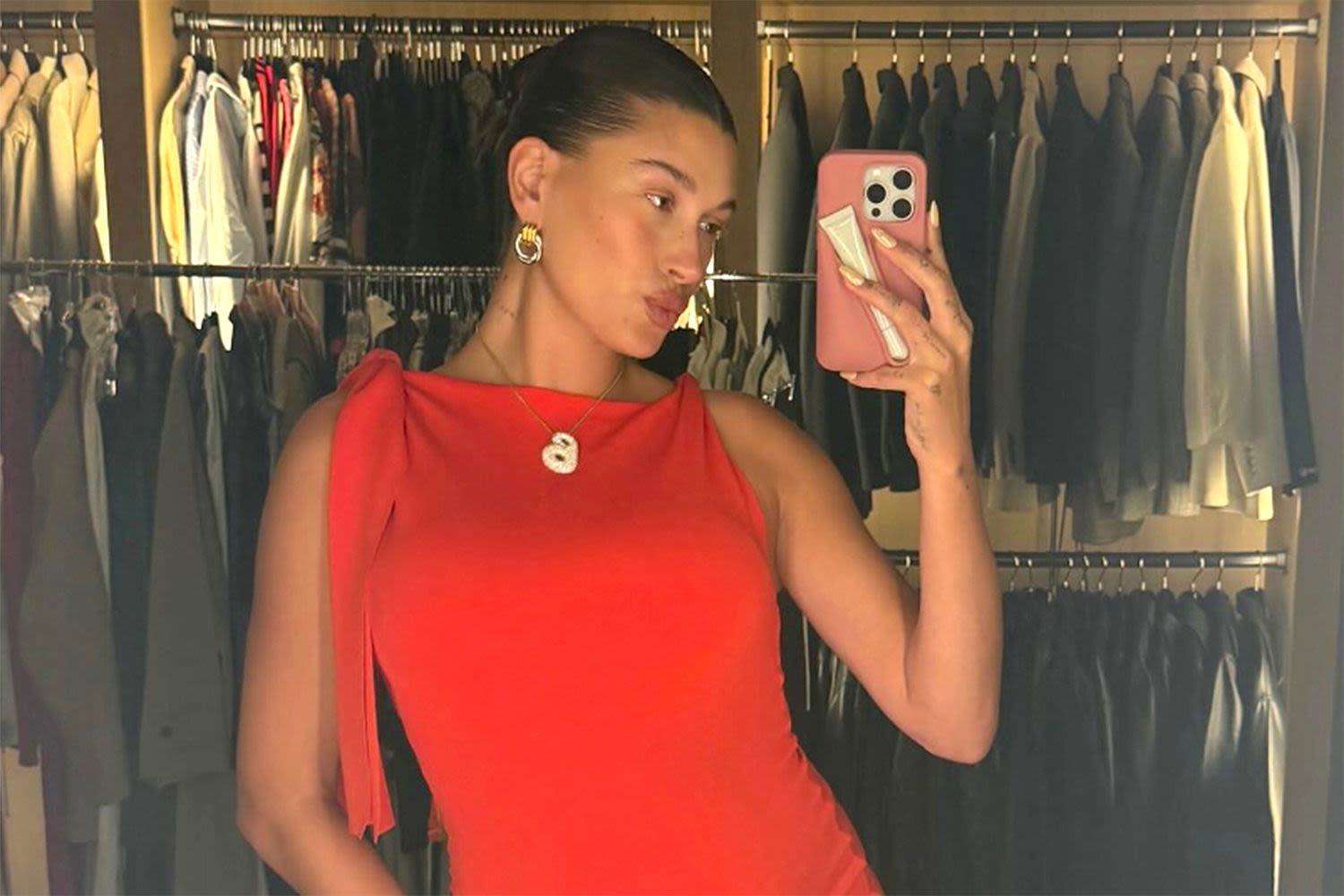 Pregnant Hailey Bieber Shows off Her Growing Baby Bump in a Chic Red Mini Dress