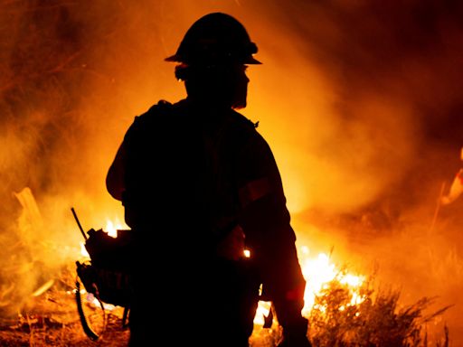 Photos show Bridge, Airport and Line wildfires raging in Southern California, torching dozens of homes and forcing thousands to evacuate