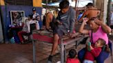 Venezuelans turn to odd jobs and gambling to stretch meager wages they hope will grow after election