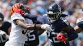 Derrick Henry bulldozes Bengals defense for TD, then throws for another in Titans' blowout win