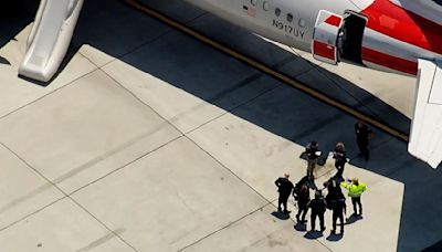 American Airlines flight from SFO to Miami evacuated after smoke from laptop fills cabin