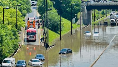 Torrential rains flood Toronto, causing power outages, traffic disruption