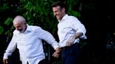 Watch: Macron holds hands with Brazilian president on Amazon trek