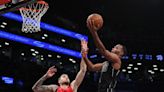 TJ Warren reacts to his return to the court for Nets after foot injury