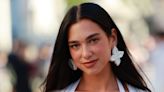 Dua Lipa is giving Morticia Addams in slinky, floor-length cutout dress