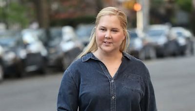 Amy Schumer shows off trim frame in double denim on the set of her latest film Kinda Pregnant in NYC - after revealing battle with Cushing Syndrome