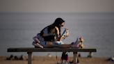 People take to the beach as a winter heat wave hits much of Spain