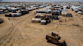 Iraq repatriates nearly 700 more citizens linked to the Islamic State group from a Syrian camp