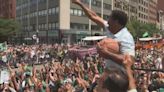 Steve Burton, David Wade complete passes to Celtics players during victory parade