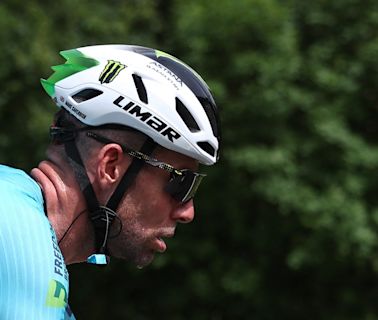 Mark Cavendish vomits on the road as he struggles on stage one of Tour de France
