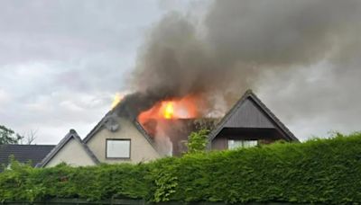 Moment house catches fire after being 'hit by LIGHTNING' amid thunderstorm chaos