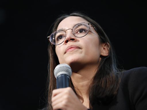 Alexandria Ocasio-Cortez jumps on stage to Cardi B at rally in viral video