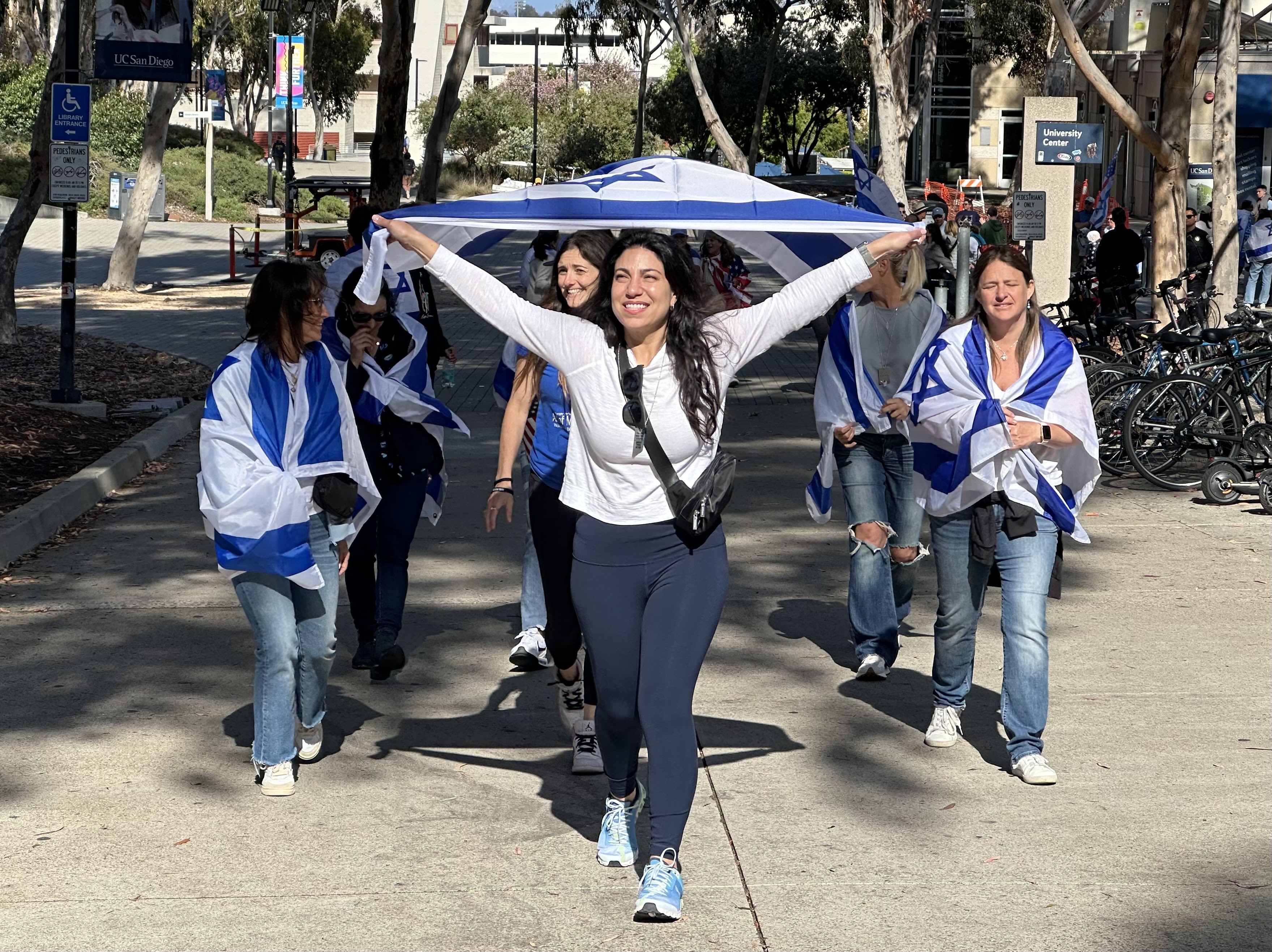 Large group of counterprotesters peacefully march outside pro-Palestinian encampment at UC San Diego