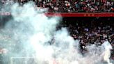 Ajax vs Feyenoord clash abandoned amid crowd chaos as flares hurled onto pitch