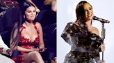 Selena Gomez appears to have a photoshoot during Demi Lovato's MTV VMAs performance