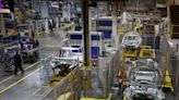 UK factory activity shrinks in April but cost pressures ease -PMI