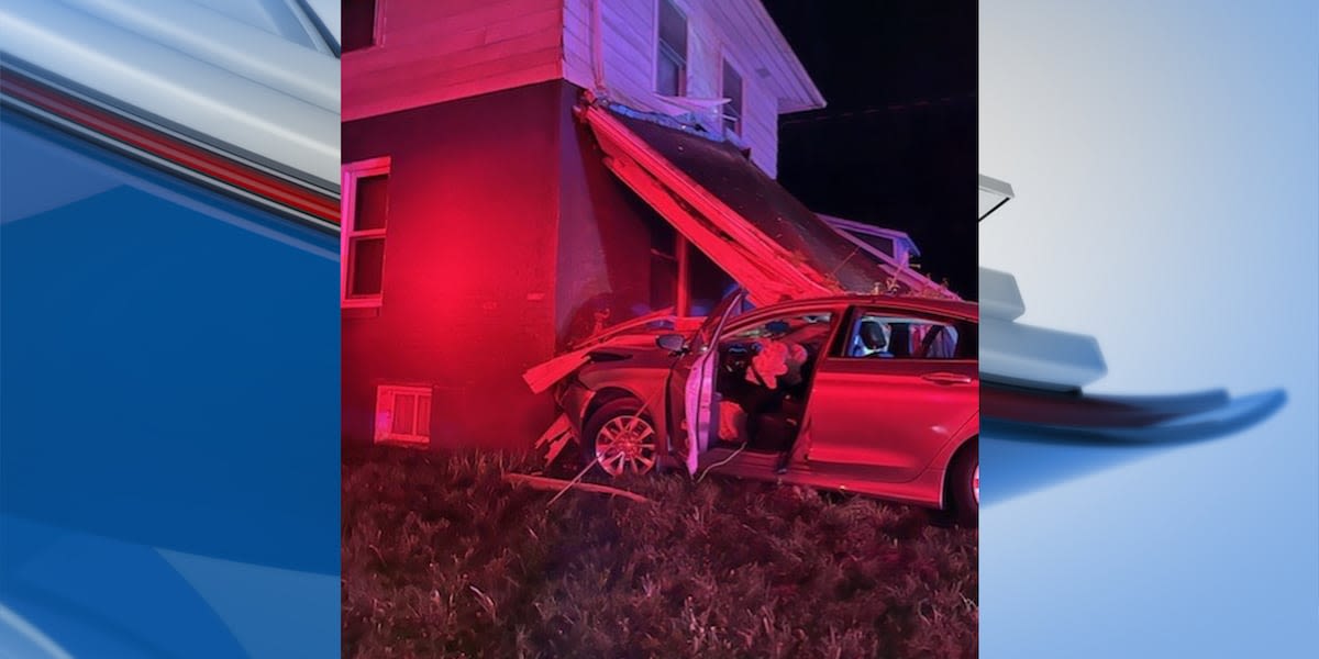 One person injured after car crashes into home in Lansing