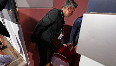 Djokovic struck on the head by water bottle while signing autographs