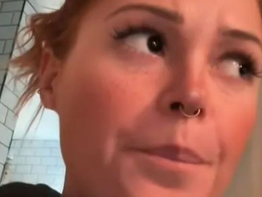 Watch the moment woman realises there's a secret door in her flat to main street