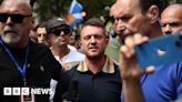 Tommy Robinson leaves UK on eve of court case with arrest warrant issued