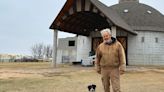 A round barn rises in rural America. There is grief and hope in its rafters