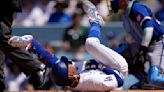 Dodgers star Mookie Betts suffers broken left hand when hit by a pitch