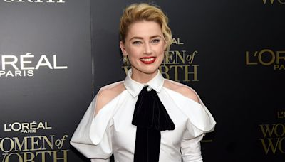 Amber Heard Drinks Champagne in Rare Photo for 38th Birthday