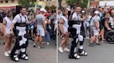 Paralympian carries Olympic flame while wearing robotic exoskeleton