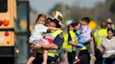 Child and adult die as lorry collides with school bus carrying 44 children in Texas